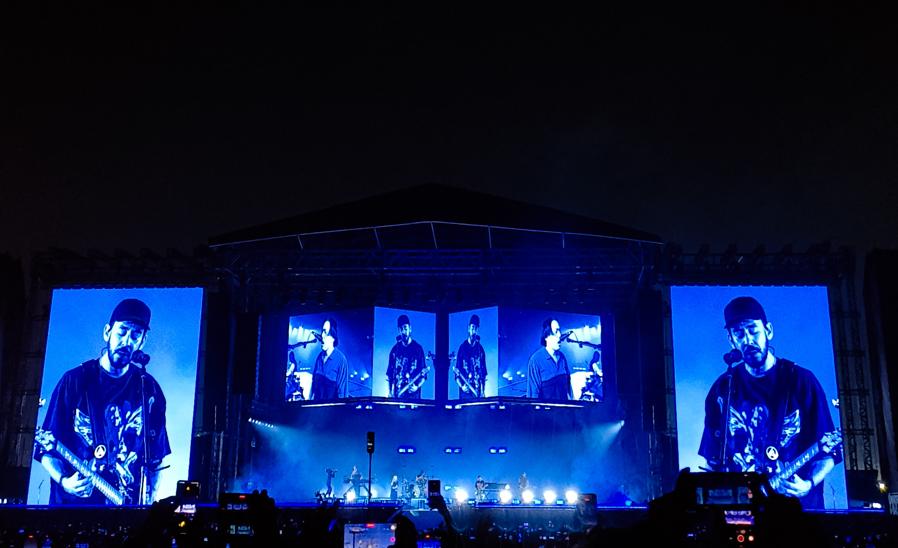Mike Shinoda under blue lights